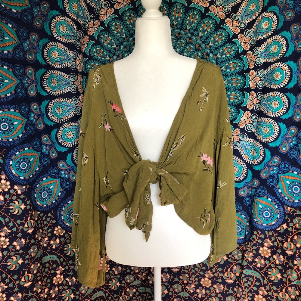 Billabong ties up long sleeve with floral design.